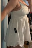 The dress was adorable and fits just as you would expect. It unfortunately didn't cover my boobs well enough (that isn't the dress's fault - I'm just a 34H, so I was not surprised by this). Heads up to ladies who are extra full in the bust, the side cut droops down a little when you fill the cup which made for unflattering side boob. Still a really pretty and comfortable dress and would absolutely recommend for the cute, delicate design. - Brooke J.