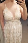 Bought this dress for my bridal shower, but could be a wedding dress for a more casual wedding. A lot fancier than I pictured it being with the lace. Needs to be shortened, or worn with higher heels. - Jean R.