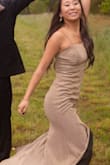 We had slight alterations, but mostly true to size. It is a beautiful dress, was worn for prom. The pictures don't do it justice, it has more sparkle in person, but not too much just right. - Lee C.