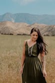 Absolutely love this dress and had some beautiful photos taken in it! I wouldn't change the size I chose because I think the next size would have been too big, but the back was just a little tight. I think that aspect honestly will vary from person to person. It does for me anyways. - Jenna B.