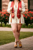 Ordered this for my grad pics because it looked somewhat forgiving in the chest (I'm 34H) and was pleasantly surprised with the room. I was a little worried because the arms look *tiny* in the picture and I have bigger arms, but they were no issues in the L or XL. I have a fuller figure, and this romper suited me perfectly (hid my upper thighs, covered my arms, hid that weird part of fat by your armpit and chest, accentuated my chest and pulled in at my waist to show off curves). But be warned the chest WILL gape open, it does not close on its own, so in all honesty I think this romper best suits the extremes, petite women or full figures (looser fit/cutesy vs really fill it out) Surprised there's no other reviews on this, it's absolutely adorable and great quality. - Brooke J.