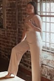 I ordered this jumpsuit for my senior prom and I absolutely loved it! The material is thick and feels/looks expensive. There's adjustable straps and the neckline sits comfortably on me. The suit was a bit too long, but I just wore 3-inch heels instead of hemming it. It looks great in pictures and everyone at my prom said it looked expensive. I danced all night and it was so comfortable. Thank you so much Lulus! - Andrea P.