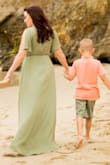 This was my first Lulus order. I bought this dress for pictures at the beach with my kids. It doesn't fit me like the model in the photo, it's more drapy on her, but I like that it was comfortable and secure, even for a larger chest. The flowy design and lightweight fabric made me feel confident and secure with my problem areas (hips and thighs). It was a bit long for me, but I was barefoot for the beach, and heels would help keep it from dragging on the ground. It also came very wrinkly, but I used the steam function on my iron to steam it and that solved the problem. While I wore a nude colored bra and panties, it is lined to mid-thigh so you might be able to get away with other options. Great dress for multiple uses! - Desirae H.