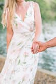This dress was amazing for our engagement pictures! The flowy bottom looked great in the breeze. It fit perfectly around my waist but was a little loose at the top. I will probably have to safety pin it when I wear it again so I don't fall out and the straps don't slip off when I sit down. - Claudia O.