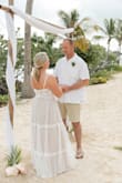 I tried on several dresses and this was my perfect beach wedding dress. I couldn't have asked for a better fit. I did have to alter the length but I am 5'2" wearing a Medium. It had a great flow to it and it wasn't as heavy as others I had tried on. I thought it looked great in person and pictured well. - Shelley H.