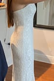 I like the material, it doesn't look cheap but as it is lace, it's easy to pull strings... it looks pretty and will be perfect for my elopement, I just need to get it hemmed a bit. - Rossana C.