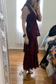 This dress is gorgeous and fits beautifully; I'm usually between a small and medium and the small fit perfectly. Because I ordered the smaller size and don't have a particularly large chest, the deep v was not too much for me. Excited to wear! - Brianna S.