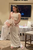I wore this to my bridal shower, it was beautiful!! The fabric was the most amazing soft but flowy material, was breathable but thick, and the back slit was perfect! Not too high or even close to revealing!! A size 6 was perfect for me, it hit floor length (I wore 4 inch heels and it was foot/ankle length). Definitely recommend! - Allison R.