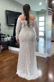The dress fit really nice on my curves and the detail at the end of the sleeve was very elegant. But the lace on the neckline wasn't as elegant as I'd like for my wedding dress. - Jannel P.