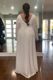 I didn't order the right size for this dress. I ordered a large even though the size chart told me to order an XL. I was able to squeeze into the dress and it was very beautiful! The lace was a unique style and the cut was very flattering. I didn't keep this dress only because I wanted something more fitted around my hips/butt. - Jannel P.