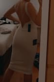 I am usually a small, but ordered the XS since it was the last size available. I was worried it'd be too tight but it actually first perfectly. The back of the dress fits snug on my back and the dress is very comfortable to move around sit and dance in. The lowest part of the back of the dress comes just below my waist line- I have a shirt/ petite figure if that helps. My only cons with this dress are how thin the fabric is and that it is a little see through. I'd HIGHLY recommend nude under garments along with even spanx for a seamless look with this dress. I will be wearing this dress for a June graduation ceremony. - Ryan F.