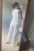 I'm always wary of jumpsuits because I have a semi short torso, but this one fit so well! I tend to be about a size 8 in dresses and pants, and the medium fits like a glove. I cant wait to wear it for my rehearsal dinner :) - Felicia S.