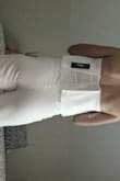 Perfect fit. Stretchy and breathable. Not see through which was a surprise for it being white and tight. It's long so I plan on getting it hemmed since I will be wearing with flats. It doesn't ride up and the top stays put!!! Favorite thing in my closet. - Samantha H.