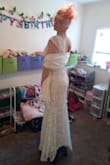 I love this dress! The quality of the dress and the fabric exceeded my expectations. The lining is beige, the lace is ivory, the appliques around the neckline are white and I feel they do not match the lace on the dressing pattern either. I had already found applications to replace them with and ordered at the same time as this dress. Overall I am thrilled with this dress and I feel like a bride. These photos were taken without shapewear or a bra. I will be wearing these for my wedding I just do not own them right now. - Keeley H.