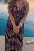 This dress is so beautiful!! Very flowy, with slits on both the sides. The ties however are made of a harsher cloth, caused rubbing around my neck. I had to put a band aid on my neck to protect it. Other then that very comfortable. - Julie V.