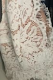 I love the skirt of the dress but the bust part has a horrible nude lining to it that is only suitable for fair skin. First of all, no one's skin tone is that "nude" color and for anyone with medium or darker skin, it is very pronounced. Considering the dress is almost $100 it shouldn't look that tacky. The dress would have been perfect if the lining was white. It could have been a beautiful dress. - Ariel V.