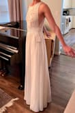 This dress feels wonderful - very comfortable fit and nice weight to the skirt. The fit was just as described. I purchased this as an option for a wedding dress for an intimate backyard wedding, and chose another option, but this dress was really lovely. - Katherine T.