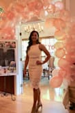 This dress was perfect for my bridal shower. The skirt runs long, but looks good with heels. Don't think it would with flats. I wish there was more of a gap between the 2 pieces. The top could have been a little see through, but I made sure to wear white underneath! - Kristen G.