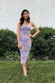 I was attending an outdoor wedding and worried I would be too hot in something with sleeves. It was 55 degrees, but the dress was SMOKING! Tons of compliments and being a midi dress I felt sexy AND classy (which the 5'8" in me appreciates). There's little structure up top (the straps are pretty stretchy as is the rest of the material) so it didn't help my small bust. That being said it also didn't hurt it. The straps are adjustable and it stayed up fine on its own. I'm ~128lbs and wear a size 4 -- VERY true to size. The fit expert recommended a size small. When I got it, I was worried it would be too tight, but the subtle ruching kept me comfortable. If my stomach wasn't flat you couldn't really tell if that was just the dress or not. I didn't think that the slit was as dramatic as it was in the photo (you can see me crossing over in the group photo to accentuate it). I can't wait to wear this again. Please keep the midi dresses coming Lulus! - Emilie S.