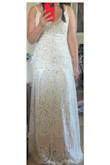 I first ordered the small size thinking the waist would need to be the ideal fit for this dress to work on me. However, when I ordered the small I realized the little pleats on the bottom were stretched in a horrid way. When I sized up (as shown in the pictures) the pleats look a lot better. However, the length is then too long and the waist is too big (I'm cinching it with my other hand in the picture) so there's bubbles of excess fabric in the back. Perhaps this dress is ideal for a straight and narrow body. I don't mind doing the alterations but I would say it's not the ideal dress for pear shaped ladies. - Jean P.