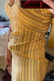 This dress had an odd fit for me. The stomach was super baggy like it had bed stretched out by a pregnant person. Yet tight in the hips. Very unflattering..... Sadly need to return this. - Kendra T.