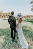 I can't say enough about this dress! I tried on 5+ wedding dress styles from Lulus and this one stole the show as soon as I put it on! My husband and I eloped (#thankscovid) and this dress was just perfect for the bohemian style we were going for. I did end up sewing the split down the front center of the dress a few more inches (it was a little too high for my taste) but didn't have to make any other alterations. Fit like a glove and got so many compliments! Don't hesitate to buy this dress!!! - Erika G.