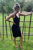 The dress is beautiful and sexy. I wore it to a wedding and got many compliments. The under skirt did keep moving up so I had to keep adjusting through out the day but other than that it was a beautiful dress. I bought a small. - Jennifer R.