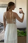 I ordered an XS originally for my wedding rehearsal dinner coming up (usual size for me ranges from XS-S) it ended up being a little long and a little loose up top so I ordered an XXS instead. The one I had received had a little bit of a greyish spot/stain on it so I contacted customer service and they sent me a new one right away! The returns were easy and the friendly customer service was very pleasant. I can't wait to wear this to my rehearsal! - Carrie K.