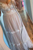 I have been trying to find a simple, romantic dress for my small "nothing fancy, just love" wedding party for august. I have tried on MANY dresses all over the board and let me tell you.... this dress is everything I have been looking for. it looks pink in certain light, but it is far from pink,  It's nude. it's perfect and definitely quality for the price. It's light and airy, comfortable. I'm 5'3" on a good day, and this dress only drags a little but with heels or any shoe, it doesn't need to be hemmed. I'm about 34D or 32ddd depending where you buy bras, I would add some extra padding or strapless bra of course, I may have the straps taken for extra support because I am top heavy and not about to bust a tata on the dance floor lol. overall 10/10.  I can not wait to wear this on my day <3 :) - Kathy S.