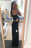 I didn't like that there was so much material in the pants, felt like they should have used 2/3 of the material and still kept the wide pant look. I also didn't like that the top was so wide in the back but I am pretty slim so maybe it's more flattering on someone a little bigger. I'm 5'5, 108lbs and usually between a small and xs but ordered this in an XS and wouldn't size up. - May L.