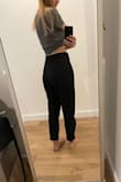 Very versatile and easy to dress up or down. I have a long torso and I'm happy these pants are high waisted enough to cover my belly button. They're a little loose in the waist so I might have to eventually belt them if they stretch out. They're very comfortable. In the photos I added, I have the pants cuffed at the bottom. - Mandy M.