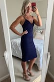 This dress fits true to size. Super comfortable. I wore it to a wedding and received so many compliments. - Lauren F.