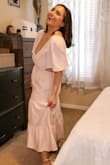 I'm a true 8 to 10 and I ordered this in a medium it fits beautifully! The shoulders do tend to slide off a tiny bit but I think if I tie the back tighter they should stay up fine.  The material is double lined so not see through even without a bra! - Julia M.