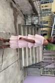 The material is flowy, moves, but it does wrinkle easily. It fits me perfectly with the medium; however, I think I would order my normal size large for more room to grow if my booty gets bigger, which I am in the gym to get fit, so it might just. It is a beautiful dress, and I received compliments on it all night and would repurchase it. I wore it to a wedding and will be wearing it to my girl's brunch date, and I am excited for all the asks of where you got that from. I sized down from the reviews but I think the large would have been perfect for me. - Shantia R.
