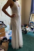 The dress is beautiful I used on my wedding day! My only concerns are first that it came a little frayed on the bottom, very minimum but it did, and second that shoulders are maybe too thin for the dress weight so it gives you a little pain after awhile, but looks amazing still. I loved it and got lots of compliments. - Carolina S.