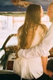 Wore this dress for our vow renewal in Vegas. It fit perfectly. Got a size small. It does require a special bra. It was not see through, but I did still wear nude undergarments so it looked better. Fabric is soft, lightweight and dress is well made. It is not short, but not long. Perfect length! Overall I highly recommend! - Nicole S.