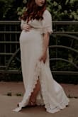 I purchased this dress in a Medium for my maternity photos. It fit perfectly and true to size! I am on the shorter side, so it did run a little long! But overall, I loved the fit of the dress, and the style. I was 32 weeks pregnant when I had these pictures done, and there was still room for my stomach to grow! 10/10 would recommend! - Taylor M.