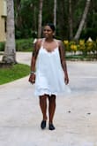 A very sweet and pretty dress! I usually wear a L and got a M and it was still a bit big, I think just how it's supposed it be. I wore it to the beach and it was perfect. if you are looking for curves, this isn't the dress. - Mukthi D.