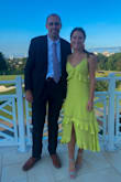 I wore this dress to a "black tie optional" wedding, the ceremony and cocktail hour were outside and reception inside. I cannot tell you how many people came up to me asking where I got the dress and how beautiful the color is. Both from other guests and people working at the venue. Not only is it a show stopping color, but the movement while walking is so flattering. I did have a little too much room in the back - even with the adjustable tie but it ended up working fine since it is a style that can be worn a little loose. It is so comfortable and looks great with a nice summer tan. Also I paired it with contrasting pink earrings (similar to how the model has bright heels) and a hot pink purse, making it even more fun. I love this dress - I will for sure wear it many more times dressing it up or down would both be so easy. - Diana P.