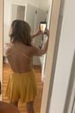 Love this romper! It was so comfortable. The only bad thing is it wrinkles very easily. I ironed it and then drove to my destination, and it was wrinkled again by the time I got there. Otherwise, it's a beautiful romper!! Love the yellow color - Brittany K.