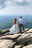 I wore this dress for my mountain top engagement pictures and it photographed beautifully! My only complaint is how low cut the dress is. I originally ordered an XXS which was a little tight and WAY too low cut for my taste. I exchanged it for the S so I could have more coverage. - Mandy F.