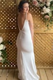 I bought and wore this dress for my intimate wedding. I was a little nervous to buy a size small knowing I was in between sizes at the time. I'm so happy that I did - the material is super stretchy and comfortable that it hugs in all the right places. I'm not very "blessed" up top but with the right sticky bra, it was very flattering! Everyone commented on how gorgeous the back was especially with the peek-a-boo lace at the bottom. It was also so comfortable that I didn't even end up changing into my second outfit! - Jenn P.