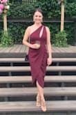 Loved this dress. Looks how it does on the model but quality could be a bit better. Zipper on the side is a bit hard to zip up. I wore it to a formal wedding and got many compliments. I ordered a size medium which fit very well. The front is super flattering hides any extra belly with enough room for under garments. Doesn't show panty lines or nipple covers. I would recommend sizing down if you're between sizes. I had a bit of room. - Aleksandra H.