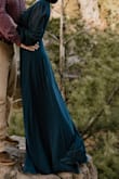 Loved this dress! Wore it for my engagement photos, I received so many compliments as we were walking through a state park, and the compliments after I got my photos back were unreal! I can't wait to wear it for upcoming weddings and events. I was long on me, but a pair of wedges helped. It flowed in the wind so beautifully for photos. It did wrinkle a bit during the hour drive but you couldn't tell. The bust fit well, but it was a bit revealing. Can't wait to wear again! - Catie H.