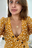 This dress is extremely girly and pleasing to the eye. The only issue, although a tailor can probably fix it, is that the dress has too much extra fabric in the upper part and if you have small boobs like me you'll need to have it taken in. But I love it! I can still wear it with a push-up bra on. But eventually I'll have it taken to a tailor. By the way, it is true to size. I got a small and I have a 27" waist. If I gain any weight it won't fit anymore because the waist of the dress doesn't stretch and it's very fitted. - Lais G.