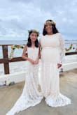 I felt like a queen on my wedding day with this dress. At the moment I tried it on, I knew it was the one. Beautiful fabric, the train details are gorgeous! It was perfect for my beach wedding dress. The color exactly as I wanted. I did not have to tailor it! Fits exactly as pictured. I also bought the no sleeve dress for my mini bride and we both looked super beautiful. 100% recommend it! - Sharlene O.
