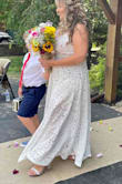 This dress was perfect for our outdoor, July, small intimate wedding!! I'm 5 ft. 4" and I did have to have it hemmed, and the split was a bit too high for me to she also tacked that a bit for me. I wore a spanx slip. I must have missed the part about the dress only having a panty underneath. The short slip was perfect for me to hide that part. All in all I ordered 7 dresses within the past 6 months, and this was my favorite with an added bling belt and bling shoes. <3 - Sheila M.