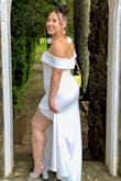 I wore this to an wedding in July where all the women were asked to wear white. The dress needed to be black tie formal, knee-length or longer, and not too ornate. This was perfect! I wouldn't normally order a large, but sticking to the size chart landed me with a perfect fit. I got lots of compliments on this stunning dress. With a 3.5 inch heel the dress just skimmed the ground. It was slightly ivory, not pure white. High quality heavy fabric that was breathable for the hot day. Like others noted, I did find the sleeves to be a little droopy - but overall very comfortable. - Michaela S.