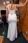 This dress is fine but not eye-catching by any means. The back fits weird, especially around the zipper area (as you can see in the picture). I wanted it for my small wedding but had to return it because I just didn't look good in it. - Tarlan C.
