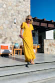 Beautiful dress with a vibrant color. I'm 5'8 and wore heels and it was still hitting the floor. I should have hemmed it. You can wear a regular bra with it which was nice. Got lots of compliments on it. - Jasmine P.